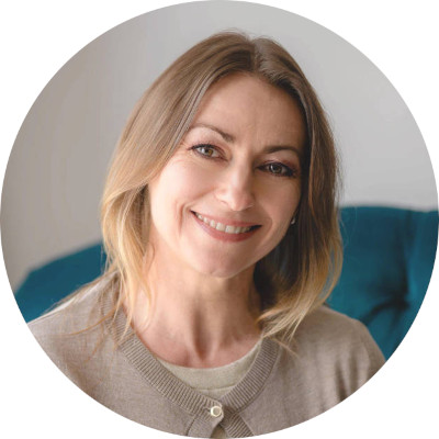 Ingrid Radford Bio pic sat on therapy chair