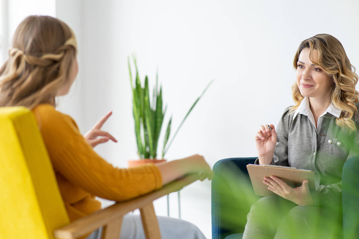therapist with client both on chairs
