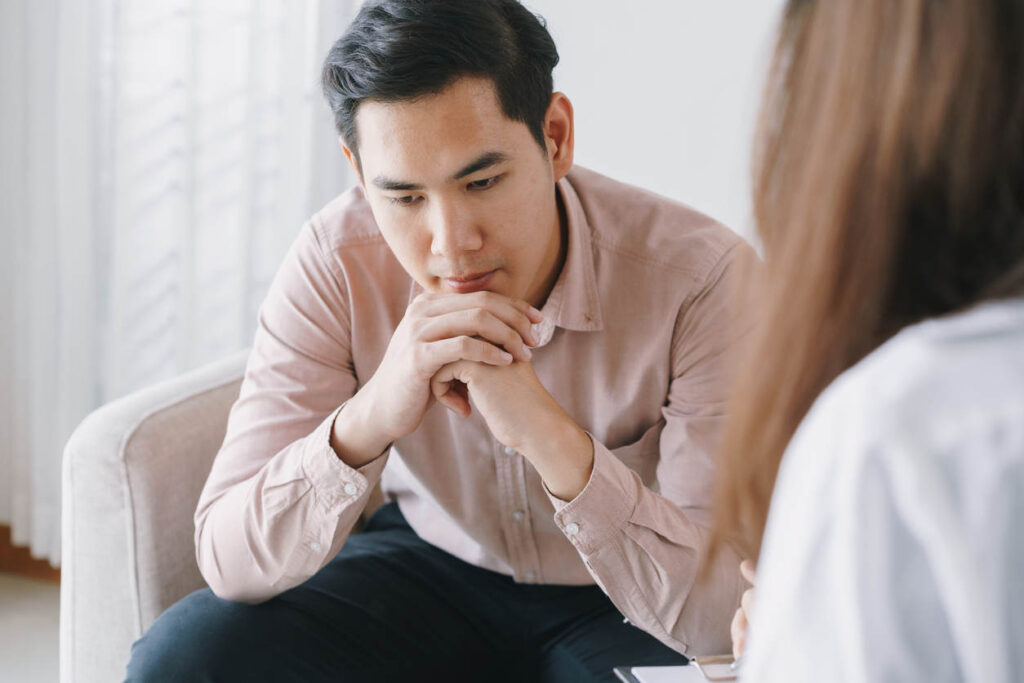 client in pain speaking to therapist