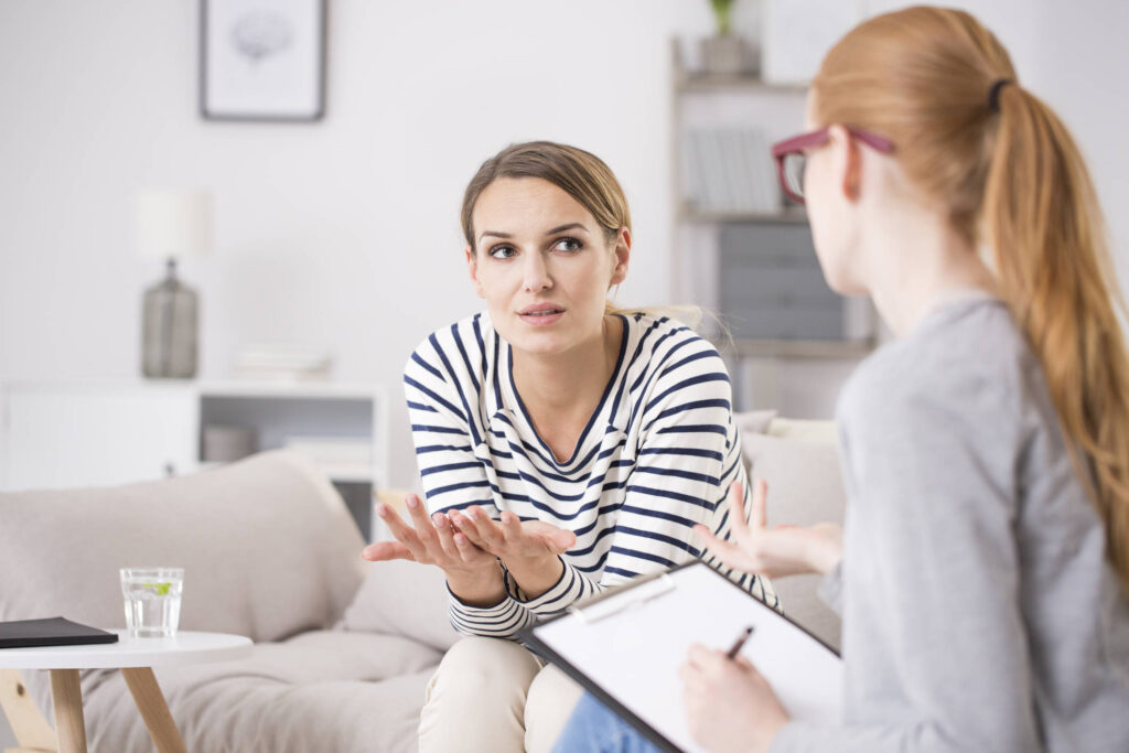 hypnotherapist client talking to therapist