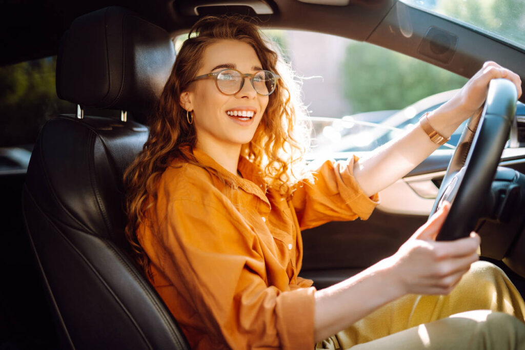 confident woman driving her car