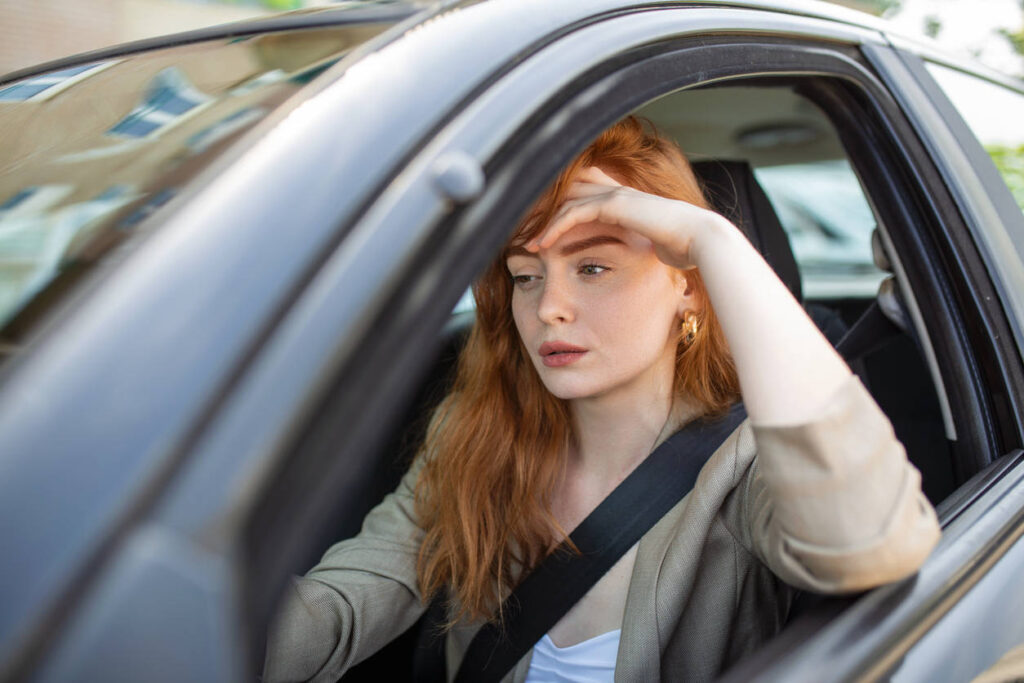 woman with driving anxiety driving a car